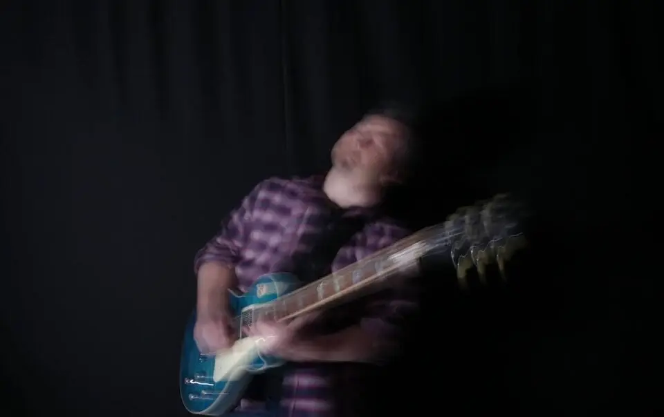 guitarist playing guitar emotionally